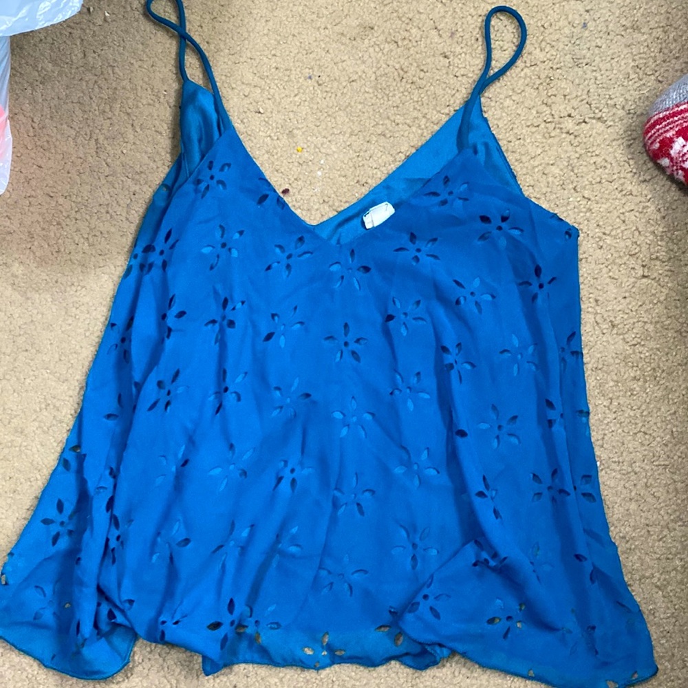Small size tank top. Mesh top with same color background. Worn a few times